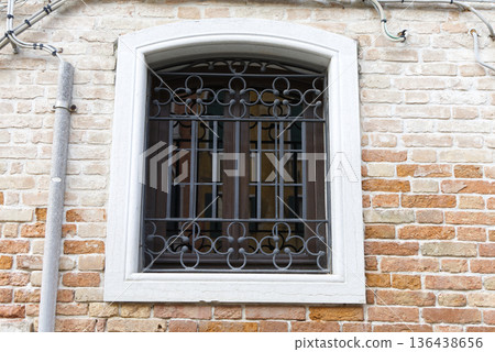 Lattice window of a brick building Lattice window of a brick building 136438656