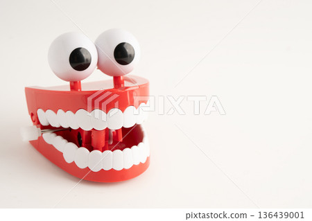Funny red teeth with eye toy denture model for dental health care. Funny red teeth with eye toy denture model for dental health care. 136439001