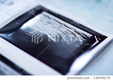 Close view of glossy film surface emphasizing reflections and vintage cinematic ambiance Close view of glossy film surface emphasizing reflections and vintage cinematic ambiance 136439276