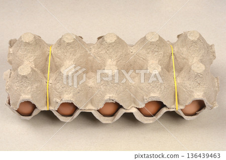 Ten brown eggs in a cardboard carton 136439463