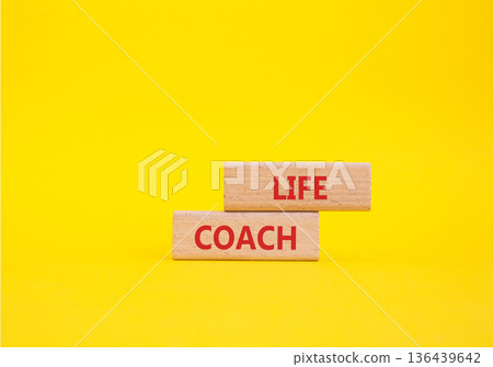 Life Coach symbol. Concept word Life Coach on wooden blocks. Beautiful yellow background. Business and Life Coach concept. Copy space Life Coach symbol. Concept word Life Coach on wooden blocks. Beautiful yellow background. Business and Life Coach concept. Copy space 136439642