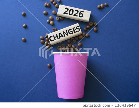 2026 Changes symbol. Concept words 2026 Changes on beautiful wooden picture frame. Beautiful deep blue background with coffee cup and coffee beans. Business and 2026 Changes concept. Copy space. 2026 Changes symbol. Concept words 2026 Changes on beautiful wooden picture frame. Beautiful deep blue background with coffee cup and coffee beans. Business and 2026 Changes concept. Copy space. 136439647
