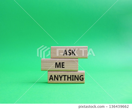 Question symbol. Concept words Ask me Anything on wooden blocks. Beautiful green background. Business and Ask me Anything concept. Copy space Question symbol. Concept words Ask me Anything on wooden blocks. Beautiful green background. Business and Ask me Anything concept. Copy space 136439662