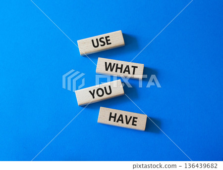 Use what you Have symbol. Concept words Use what you Have on wooden blocks. Beautiful bright blue background. Business and Use what you Have concept. Copy space. 136439682