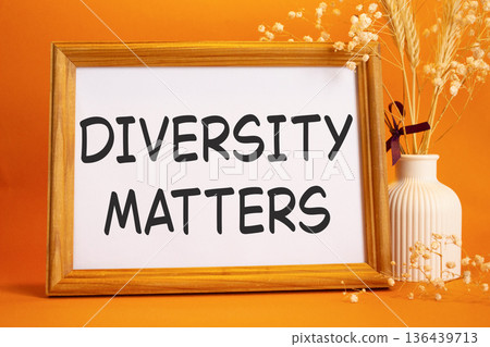 Diversity matters symbol. Concept words Diversity matters on beautiful wooden picture frame. Beautiful orange background with flower vase. Business and Diversity matters concept. Copy space. Diversity matters symbol. Concept words Diversity matters on beautiful wooden picture frame. Beautiful orange background with flower vase. Business and Diversity matters concept. Copy space. 136439713