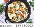 Delicious haddock fish piccata with lemon and capers in cast iron pan, horizontal, top view 136439992