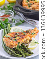 Delicious haddock fish piccata, battered fish fillet with capers, lemon and asparagus, vertical 136439995