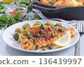 Delicious pan seared fish with capers, brussels sprouts, and lemon, horizontal 136439997