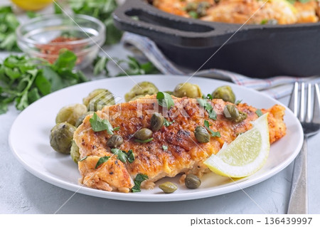 Delicious pan seared fish with capers, brussels sprouts, and lemon, horizontal Delicious pan seared fish with capers, brussels sprouts, and lemon, horizontal 136439997