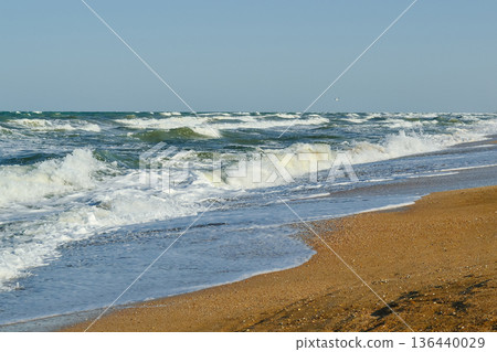 The sea wave hits the shore and rocks on the shore. The sea wave hits the shore and rocks on the shore. 136440029