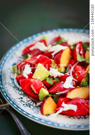 Fresh spring salad witn avocado, tomato, peach, red onion and herbs Fresh spring salad witn avocado, tomato, peach, red onion and herbs 136440180