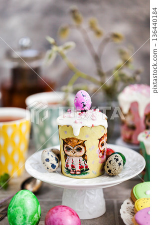 Sweet Easter bread, panettone or kulich and colorful painted eggs, Holiday spring concept 136440184