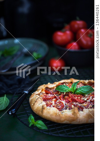 Delicious homemade rustic tomato and cheese open pie (galette) Delicious homemade rustic tomato and cheese open pie (galette) 136440261