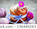 Sweet Easter bread, panettone or cruffin and colorful painted eggs, Holiday spring concept 136440263