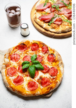 Two Italian pizza on wooden background Two Italian pizza on wooden background 136440496