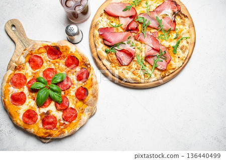 Two Italian pizza on wooden background Two Italian pizza on wooden background 136440499