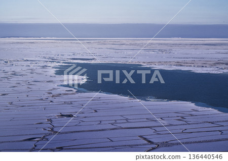 Frozen Arctic Waters Revealing Melt Pools Amidst Fragmented Ice Sheets Frozen Arctic Waters Revealing Melt Pools Amidst Fragmented Ice Sheets 136440546