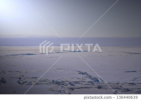 Frozen Arctic Waters Revealing Melt Pools Amidst Fragmented Ice Sheets Frozen Arctic Waters Revealing Melt Pools Amidst Fragmented Ice Sheets 136440639