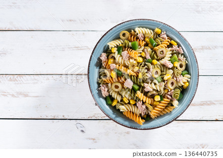 Pasta salad with tuna, corn and olives in bowl 136440735