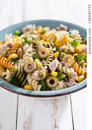 Pasta salad with tuna, corn and olives in bowl 136440743