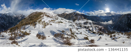 Chamois alpine village aerial view in winter season 136441135