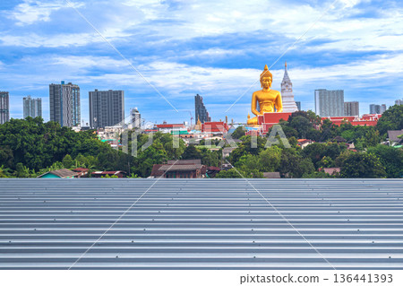 A large seated Buddha or Buddha Dhammakaya Dhepmongkol at Paknam Phasi Charoen temple on a blue sky day. A large seated Buddha or Buddha Dhammakaya Dhepmongkol at Paknam Phasi Charoen temple on a blue sky day. 136441393