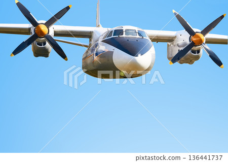 Blue sky, old air propeller driven passenger plane Blue sky, old air propeller driven passenger plane 136441737