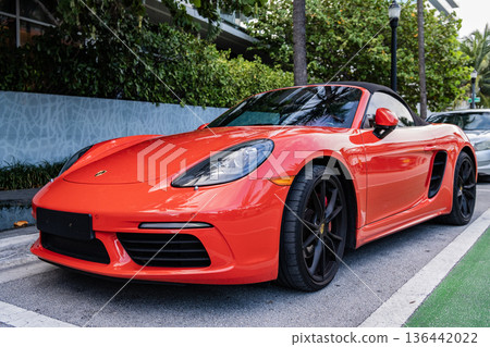 Miami Beach, Florida USA - June 9, 2024: 2018 Porsche 718 Boxter s orange color at miami beach. luxury car porshche at ocean drive Miami beach. front corner view Miami Beach, Florida USA - June 9, 2024: 2018 Porsche 718 Boxter s orange color at miami beach. luxury car porshche at ocean drive Miami beach. front corner view 136442022