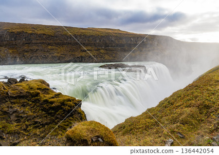 Majestic Gullfoss waterfall route. Icelandic mountain nature landscape. Waterfall landscape. Nature wildness. Iceland waterfall travel destination. Picturesque Gullfoss waterfall. Travel to Iceland 136442054