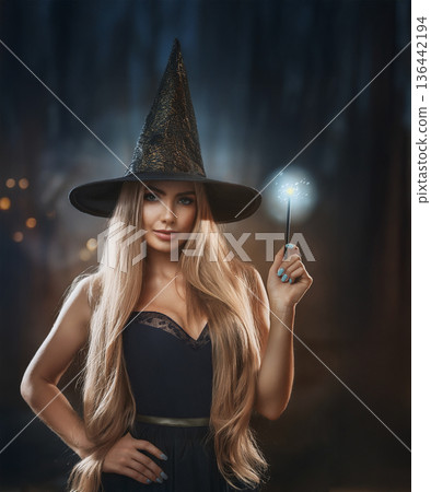 Glamorous and attractive witch or sorceress at Halloween 136442194