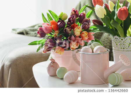 Easter Table with Tulip Bouquets, Eggs and Festive Decor. Cozy Spring Arrangement Easter Table with Tulip Bouquets, Eggs and Festive Decor. Cozy Spring Arrangement 136442660