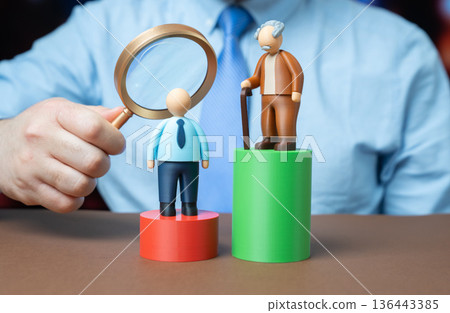 An older man is significantly ahead of a younger man on the scale. The difference in accumulated capital. The generation gap. Wealth inequality sparks dialogue on savings and mobility. 136443385