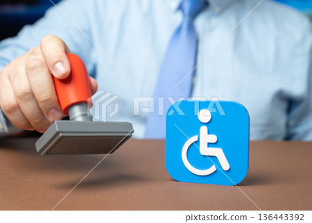 An official with a seal and a symbol of a person with a disability. Obtaining disability status. Social assistance and benefits. Clear procedures and advocacy help citizens receive fair support. An official with a seal and a symbol of a person with a disability. Obtaining disability status. Social assistance and benefits. Clear procedures and advocacy help citizens receive fair support. 136443392