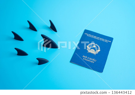 Vietnamese passport and shark fins heading towards it. Pursuit of citizenship. Migration trends, and citizenship challenges. High requirements and bureaucracy for residence. Migration problem. Vietnamese passport and shark fins heading towards it. Pursuit of citizenship. Migration trends, and citizenship challenges. High requirements and bureaucracy for residence. Migration problem. 136443412