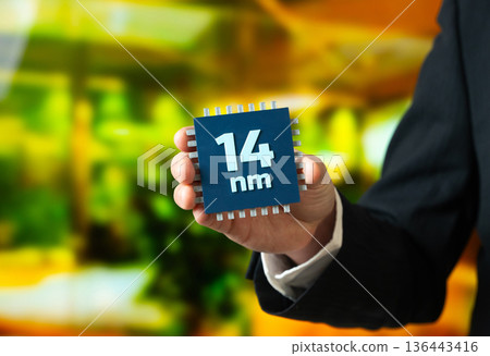 Production of computer microchips using the 14 nm process technology. Industrial scale and cost efficiency. Mature chip technology supporting electronics. Semiconductor manufacturing concept, Production of computer microchips using the 14 nm process technology. Industrial scale and cost efficiency. Mature chip technology supporting electronics. Semiconductor manufacturing concept, 136443416
