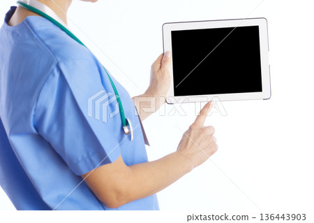 Close-Up of Doctor Holding Medical Tablet Device Close-Up of Doctor Holding Medical Tablet Device 136443903