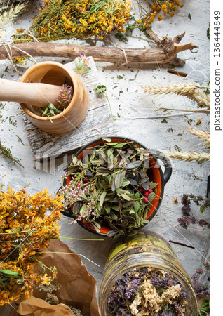 different wild medicinal dry herbs: white yarrow herb blossoming, yellow tansy herb, marjoram, St. John's wort at white background different wild medicinal dry herbs: white yarrow herb blossoming, yellow tansy herb, marjoram, St. John's wort at white background 136444849