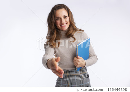 Professional Woman Offering Handshake with Document Folder 136444898