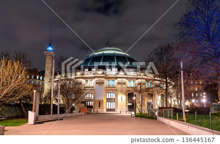 Bourse de Commerce Pinault Collection in Paris France. Historic domed architecture features the attached Medici Column illuminated at night Bourse de Commerce Pinault Collection in Paris France. Historic domed architecture features the attached Medici Column illuminated at night 136445167