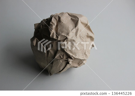 A ball of thick wrapping paper that looks like a head of cabbage 136445226