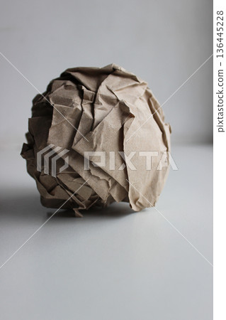Paper recycling. Wrapping paper tightly rolled into a ball after use 136445228