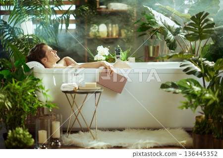 Relaxing Read in a Lush Bathroom Oasis Relaxing Read in a Lush Bathroom Oasis 136445352