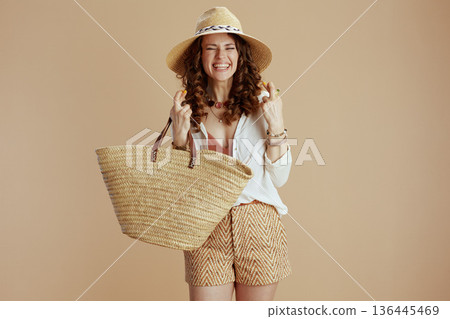 happy trendy housewife in blouse and shorts isolated on beige happy trendy housewife in blouse and shorts isolated on beige 136445469