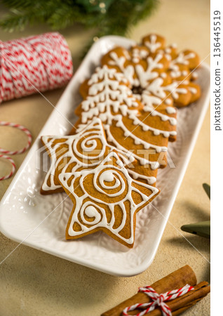 Holiday background. Christmas gingerbread cookies, festive food, home baking. Flat lay Holiday background. Christmas gingerbread cookies, festive food, home baking. Flat lay 136445519