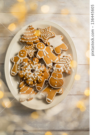 Holiday background. Christmas gingerbread cookies in different shapes in a plate 136445605