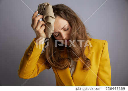 Manager Uses Paper Bag for Headache Relief 136445669