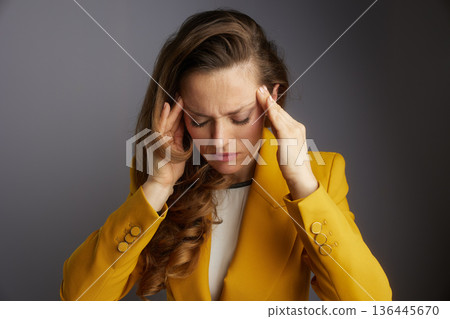 Professional Woman Overwhelmed by Headache 136445670