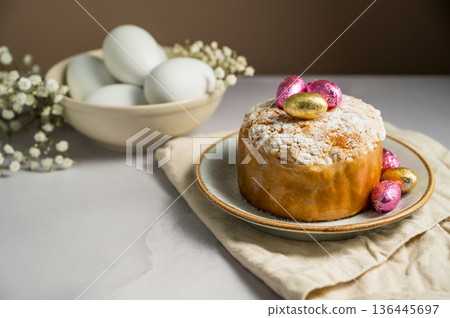 Easter cake with chocolate easter eggs, white easter eggs and gypsophila flowers. Spring holidays Easter cake with chocolate easter eggs, white easter eggs and gypsophila flowers. Spring holidays 136445697