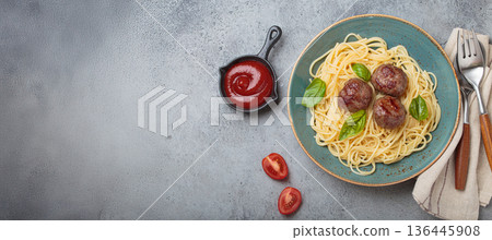 Delicious spaghetti with meatballs on plate, tomato sauce and basil on gray background top view, space for text 136445908