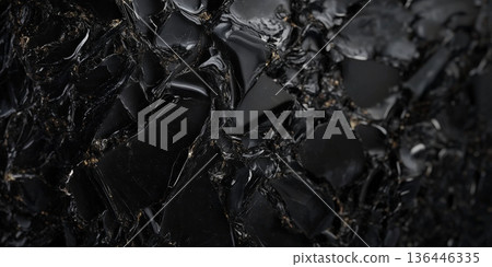 Dark obsidian stone background with glossy black glass-like surface, sharp and dramatic. Dark obsidian stone background with glossy black glass-like surface, sharp and dramatic. 136446335